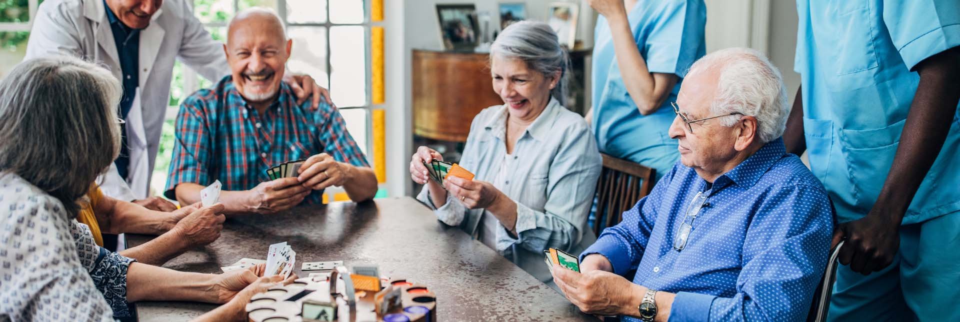 Group of elderly people playing cards