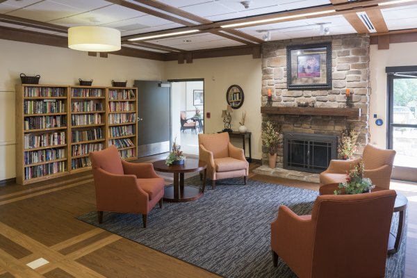 Library and seating area with fireplace